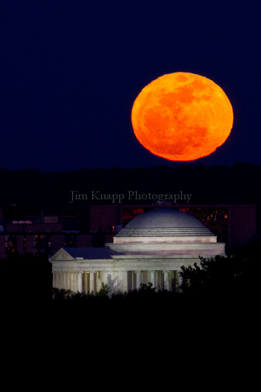 The full moon rises over the Jefferson Memorial